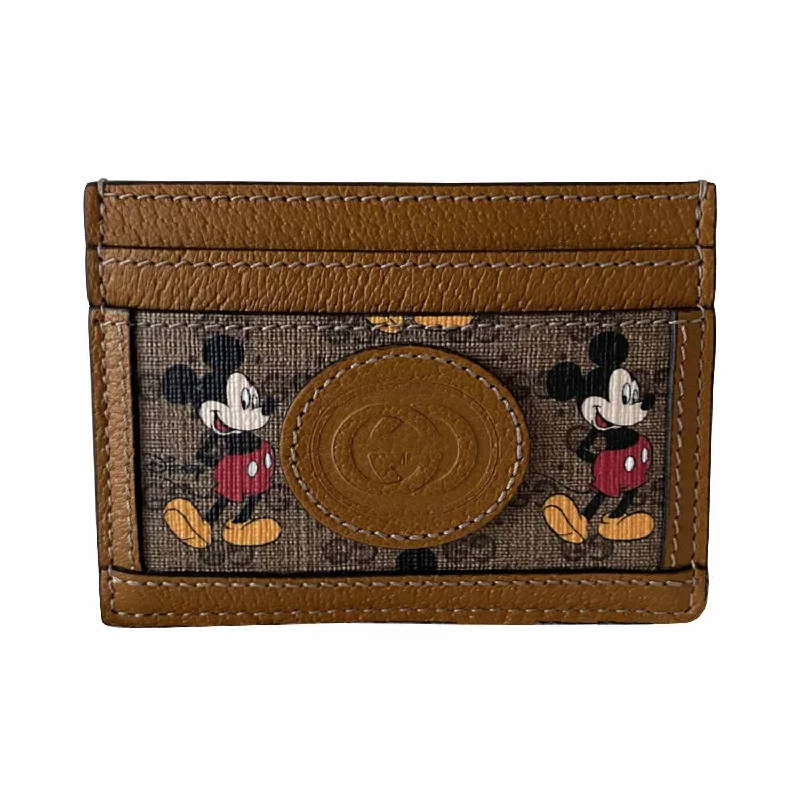 Women Gucci Sylvie bags featuring the signature web stripeGucci Limited Edition Gucci x Disney Card Holder