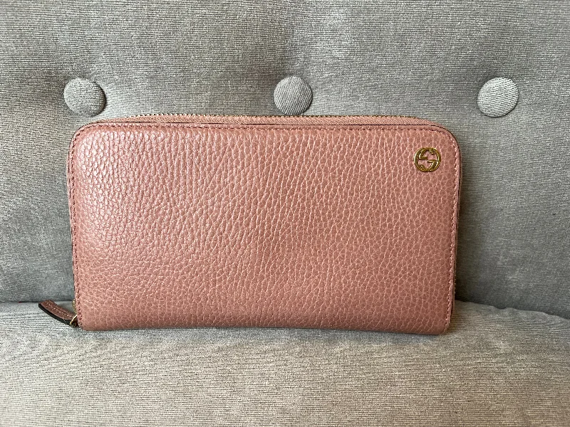 Women Gucci Sylvie bags featuring the signature web stripeGucci Pale Pink GG Long Wallet