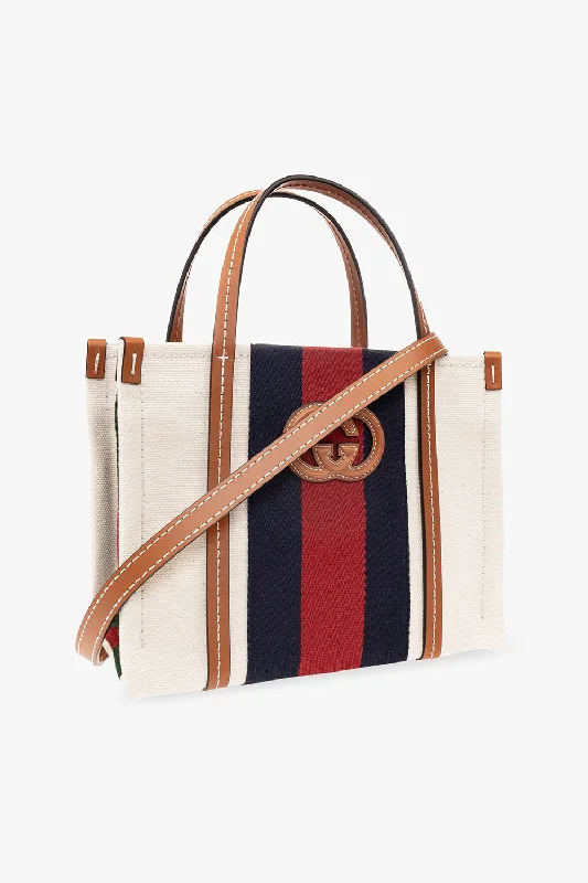 Gucci tote bags for women with a water - resistant coatingGUCCI INTERLOCKING G WEB MINI TOTE BAG