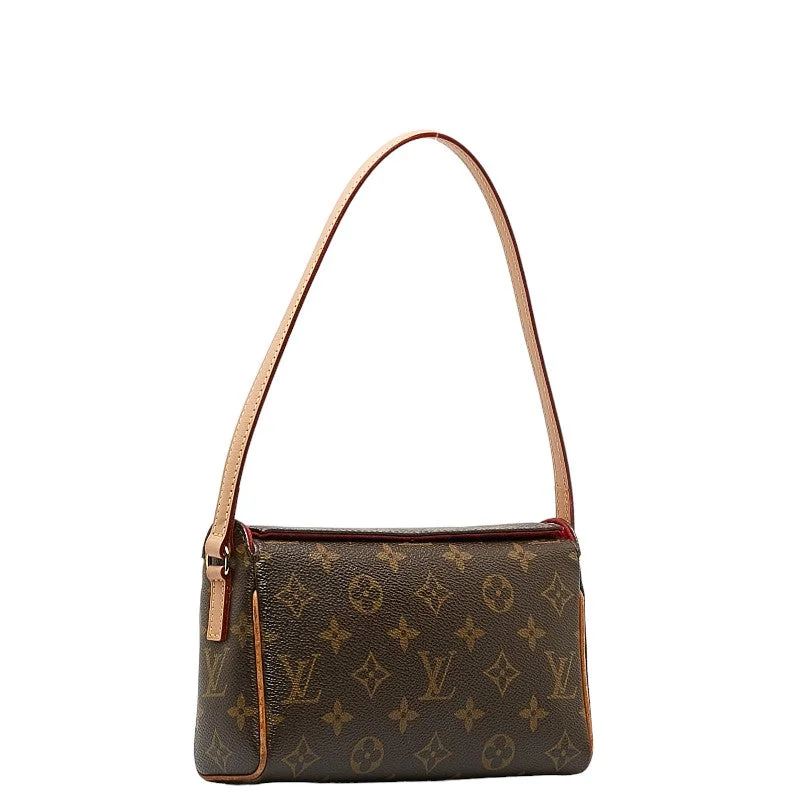 Louis Vuitton Twist bags with a contrast - colored interior for visual interestLouis Vuitton M51900 Brown PVC Leather  Louis Vuitton M51900 Leather Handbag Louis Vuitton