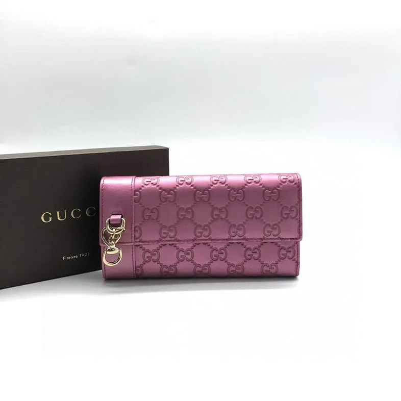 Women Gucci Sylvie bags with a leather - wrapped handleGucci Pink Embossed Leather Wallet