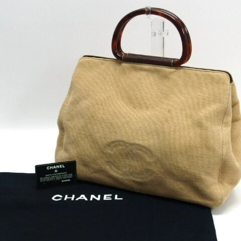 Chanel bags with leather and tweed combinationsCHANEL Tortoiseshell Handle Canvas Tote Coco Mark Beige