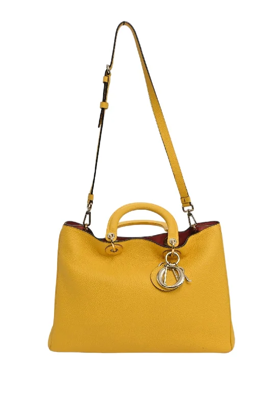 Christian Dior Saddle bags with a distressed leather finishCHRISTIAN DIOR Yellow grained leather Diorissimo top handle shopper tote with detachable shoulder strap