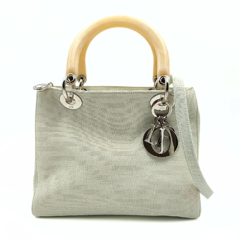 Christian Dior bags with a detachable coin purse insideChristian Dior Christian Lady bag in pastel water green canvas