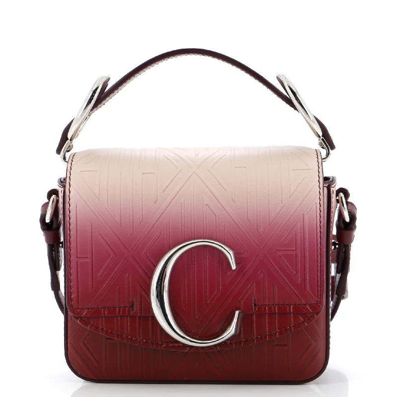 Christian Dior Saddle bags with a studded trim for a bold lookC Flap Bag Embossed Leather Mini